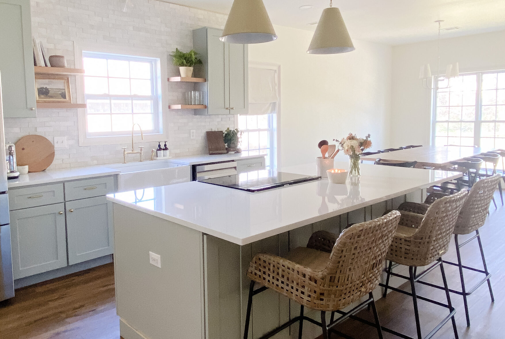 Kitchen renovation with island, wood floors and clay tile backsplash